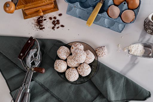 A top view of ready Pryanik cookies and their ingredients on the table