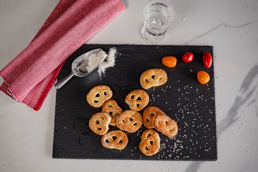 A top view of freshly baked pastry on a black plate