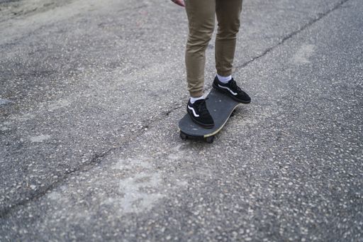 A closeup shot of a skater riding a skateboard