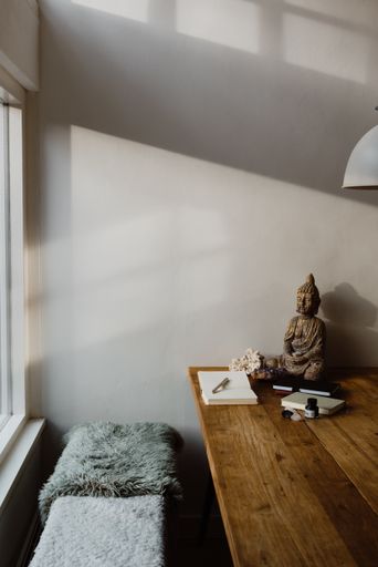 Daylight table with Buddha in the countryside