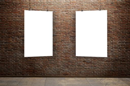 A stone brick wall background with two blank posters as a copy space