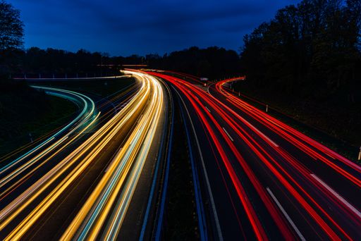 Night traffic with long exposure light trails of cars