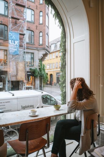 Female sitting in Danish coffee shop