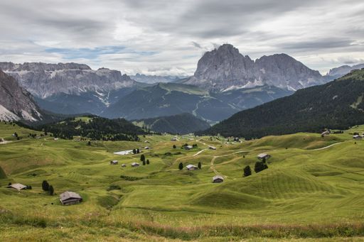A top view shot of a green valley in Puez-Geisler Nature Park in Miscì, Italy