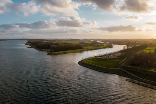 A high angle shot of a beautiful river under a cloudy sky in Veere, The Neverlands