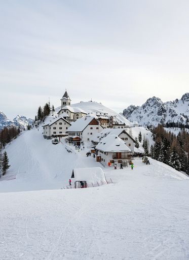 The picturesque village on top of a hill in snowy weather in Monte Lussari, Tarvisio, Italy
