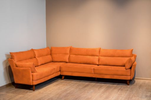A closeup shot of an orange coach in a room
