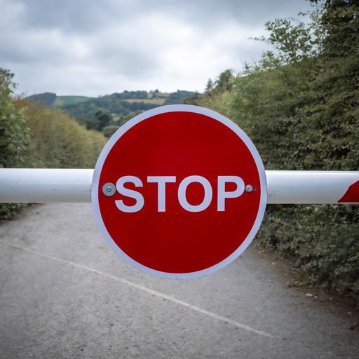 A red Stop sign blocking the road