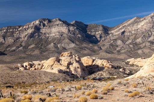 A beautiful shot of rock formations in the middle of a desert on a hot sunny day