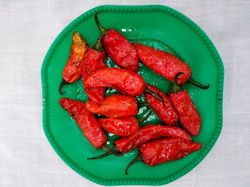 A top view of red chili peppers on a plate