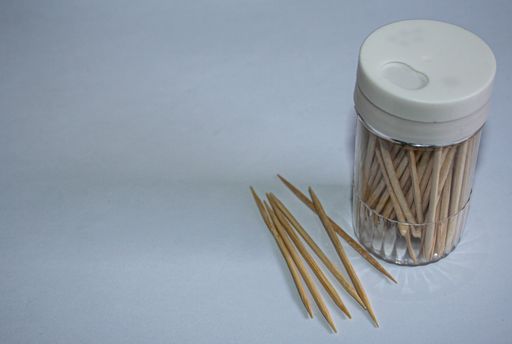Wood toothpicks isolated on blue background