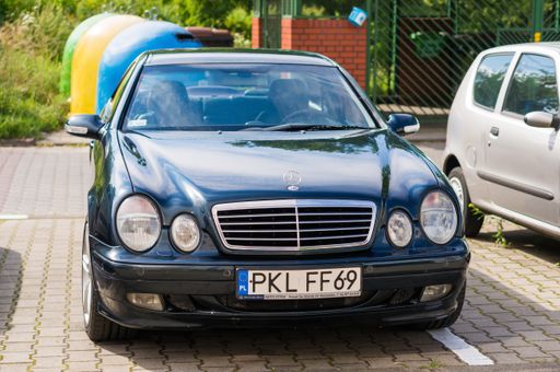 Parked luxurious Mercedes Benz on a parking spot