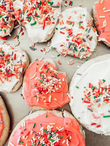 A vertical shot of delicious freshly baked glazed biscuits with sprinkles