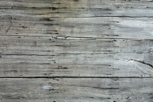 A closeup shot of several pieces of grey woods next to each other