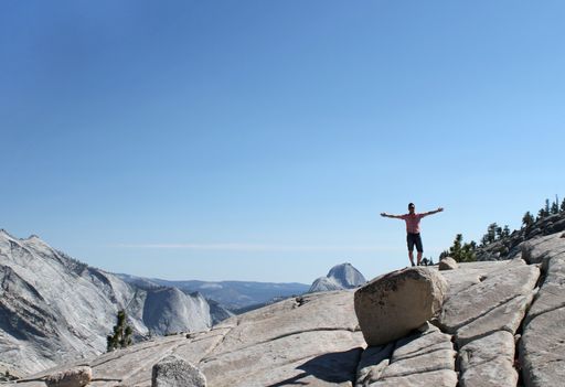 A wide angle shot of a man standing in the Yosemite National Park in the US