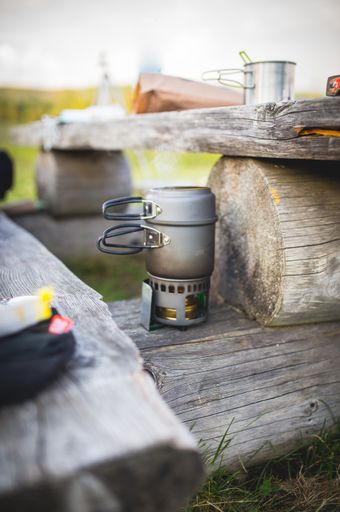 vertical shot a stove in the woods - bushcraft feeling, vibe