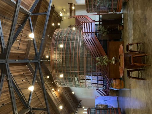A vertical shot of the inside a winery to a barrel room in downtown Sonoma, California