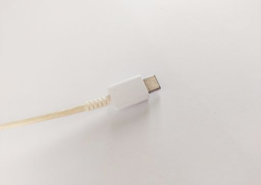 A closeup of micro USB cable on white background