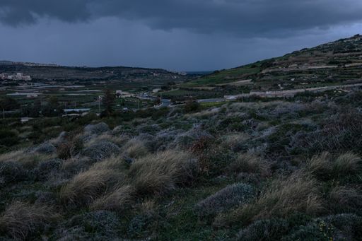 Rain storm approaching east coast. Towns of Manikata near left, Mellieha on horizon left, Saint Paul’s Bay centre at end of Pwales valley. Malta