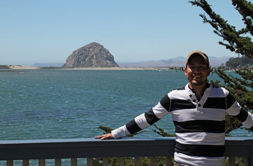 A man standing in front of the Morro Bay Golf Course in the United States