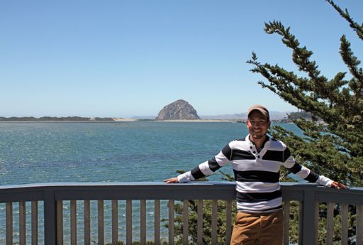 A man standing in front of the Morro Bay Golf Course in the United States