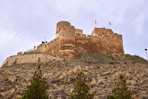 Scenic side view of the castle of Biar on the mountain in the Valencian community, Spain