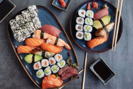 A top view of a delicious and vibrant sushi platter featuring arranged in a decorative manner