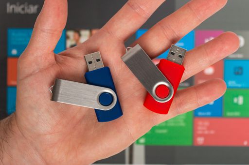 A top view of two USB flash drives on a hand