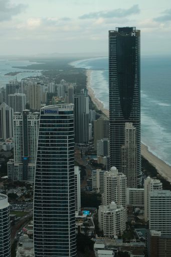 A stunning aerial view of an ocean shoreline lined with high-rise buildings