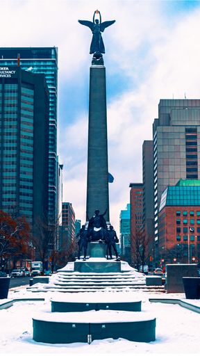 A vertical shot of the South African War Memorial in downtown Toronto.