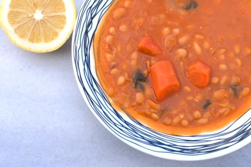 Greek traditional food, bean soup, fasolada . on wooden table