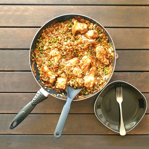 high angle view of cooked food in pan made with rice and chicken on table