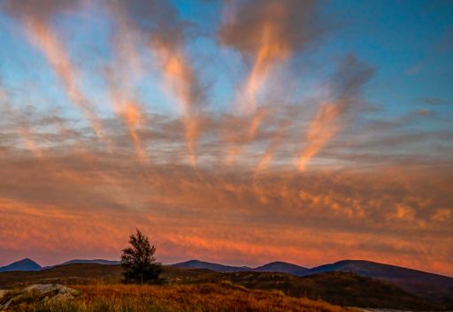 A beautiful shot of a cloudy sky during sunset over a landscape