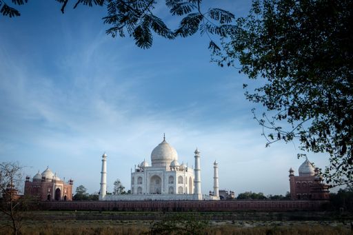 The splendid Taj Mahal, Islamic ivory-white marble mausoleum against the blue sky in Agra, India