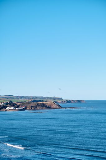The Scarborough coast under a clear blue sky during daytime