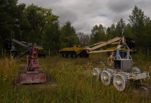 An aged machine cleaning the contaminated area after the catastrophe in the power plant