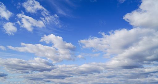 A wide-angle shot of the blue cloudy sky on a sunny day - perfect for wallpapers
