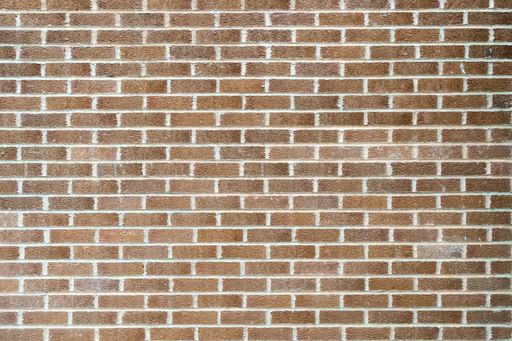A closeup shot of a wall made of rectangular bricks