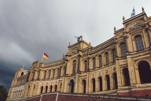 A low angle shot of the Maximilianeum building in Munich, Germany under a cloudy sky