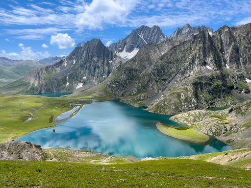 A beautiful landscape of Lake Krishansar with cliffs in the background in Jammu and Kashmir, India