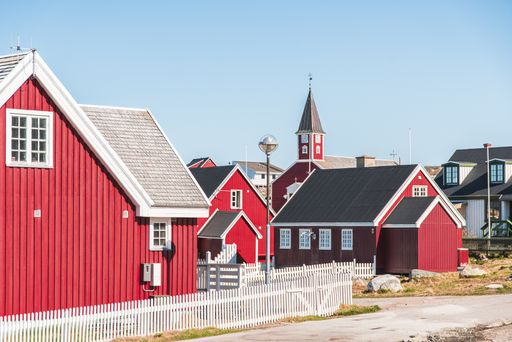 Picture of red colored houses and church in a district of Nuuk, capital city of Greenland