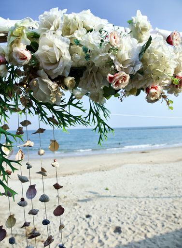 Beautiful decorative flowers and seashells on rope lines at the beach in Phetchaburi, Thailand