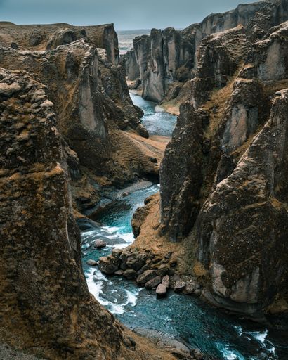 the majestic Fjarrargljufur canyon with a river running through