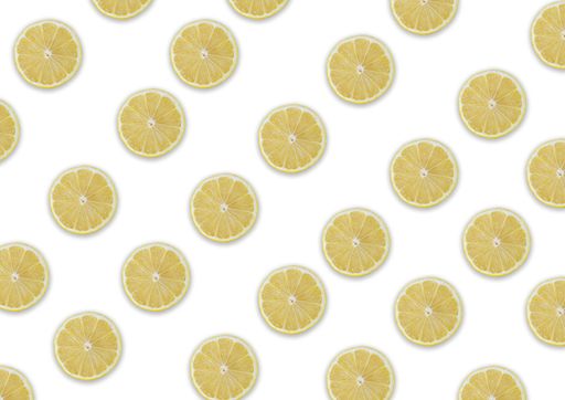 A seamless pattern of lemon slices with shadows on a white background