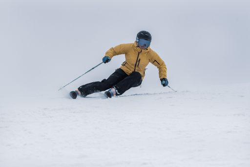 A young woman skiing on a sunny day in Andorra