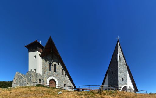 A beautiful view of an ecumenical chapel on Mount Bekecs in Romania against a clear blue sky