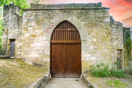 A beautiful view of an old brick castle with a brown door in Bavaria, Germany