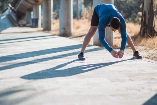 A closeup shot of a Hispanic male doing exercises outdoor