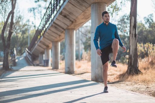 A closeup shot of a Hispanic male doing exercises outdoor