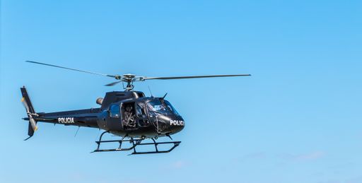 A police helicopter on a blue sky